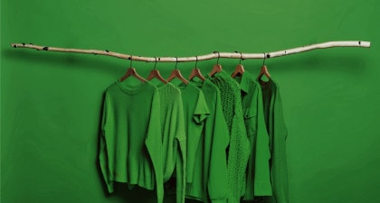 green clothing assortment on hangers