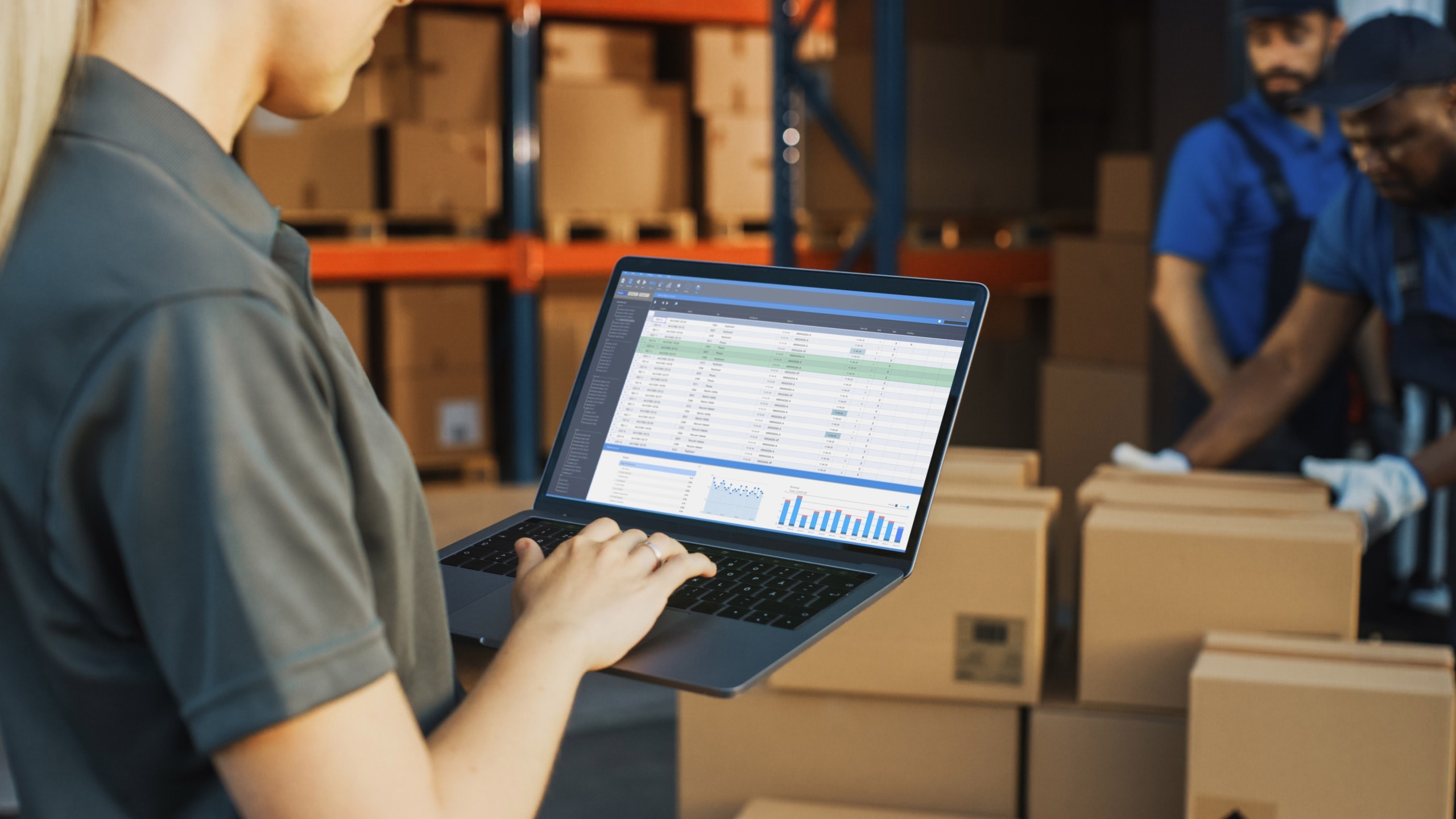 warehouse worker checking inventory on a planning system in the DC or warehouse